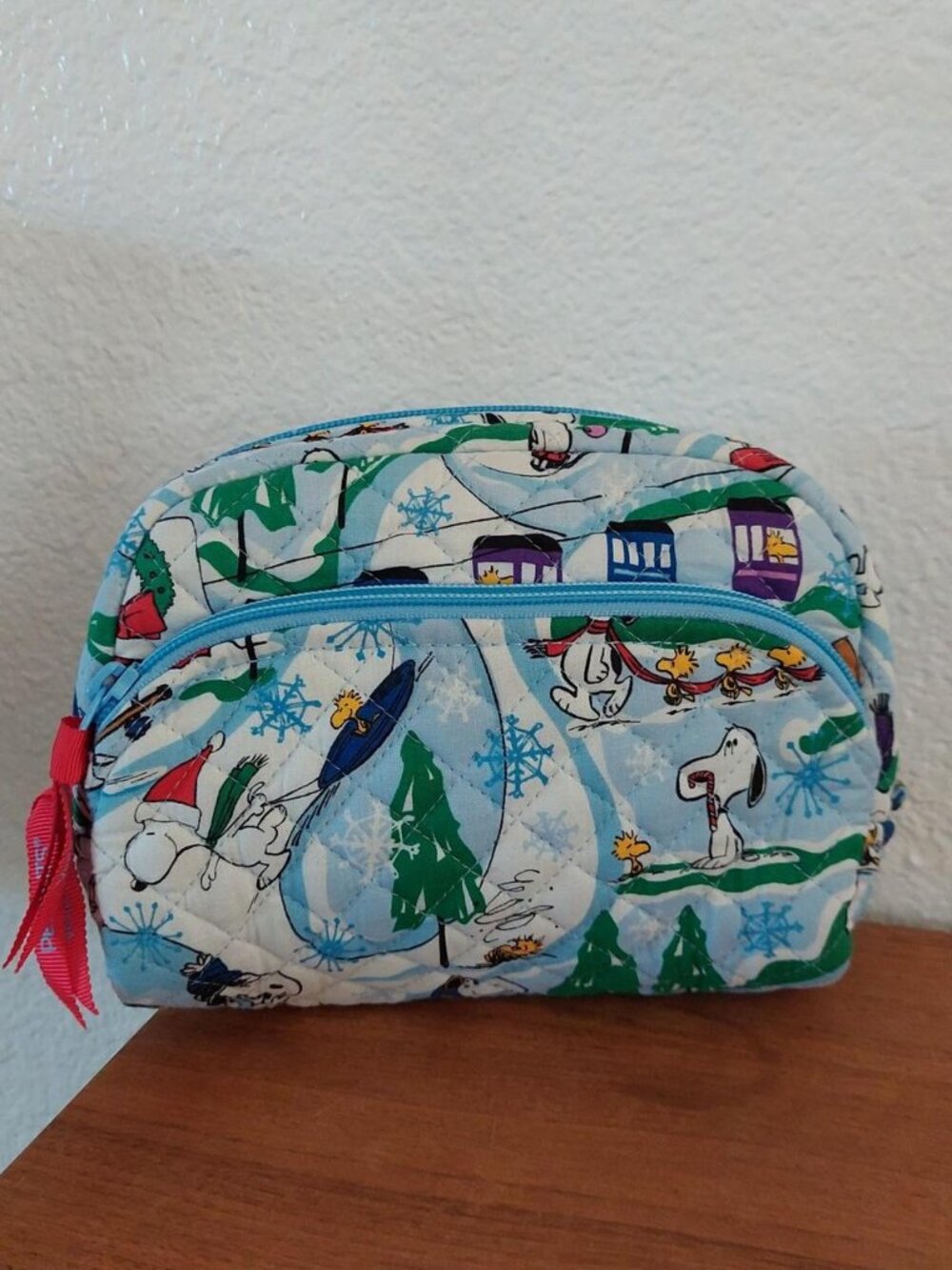 Peanuts Snoopy Christmas quilted makeup bag with Snoopy and friends in a snowy s
